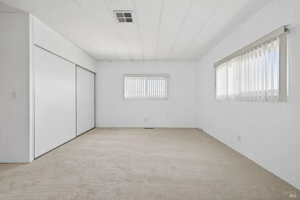 a bathroom with a double vanity sink and mirror