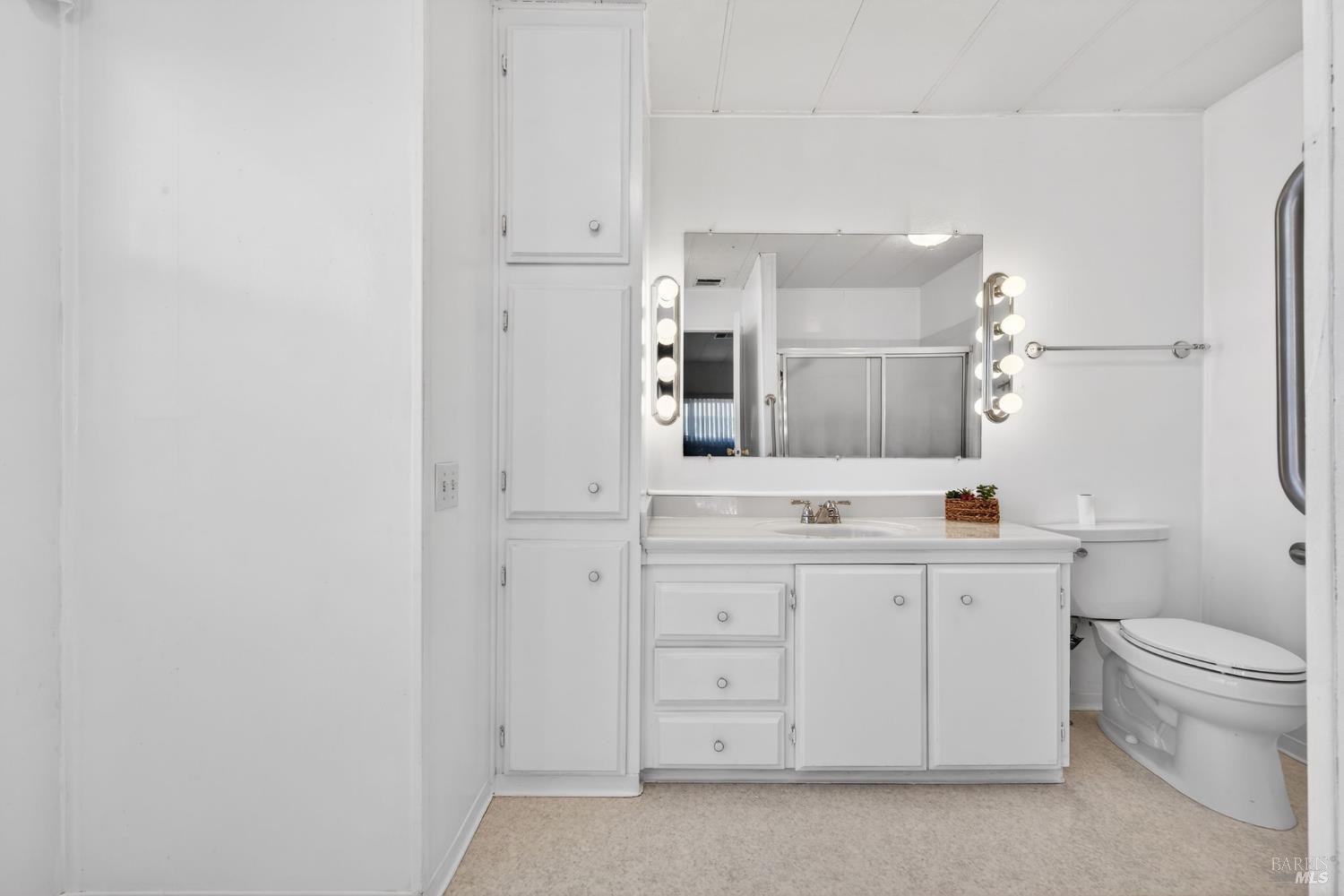 92 Anacapa Drive Santa Rosa, CA 95403 - Photo 32 of 46 a spacious bathroom with a granite countertop sink a toilet and a mirror