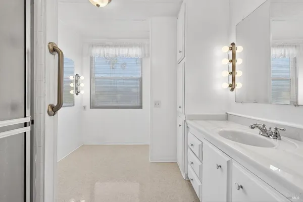 a bathroom with a sink and a shower