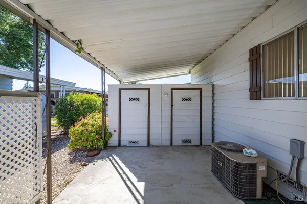 a close up of a storage and utility room with washer and dryer