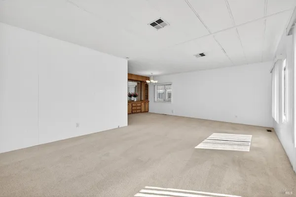a view of a room with an empty space