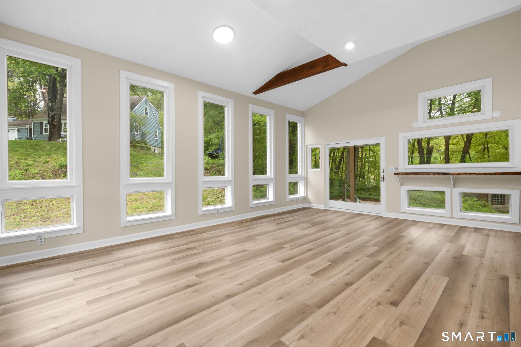 7 Sycamore Terrace Windham, CT 06280 - Photo 13 of 40 a view of an empty room with wooden floor and a window