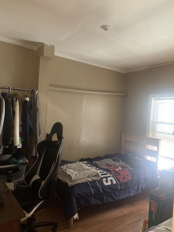 34 Grove Street Lynn, MA 01905 - Photo 22 of 37 a bedroom with a bed and a window