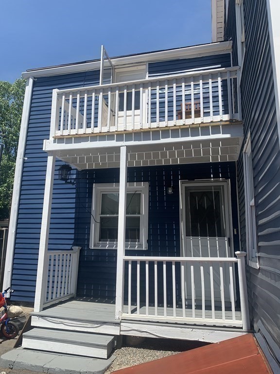 34 Grove Street Lynn, MA 01905 - Photo 28 of 37 a front view of a house and a balcony