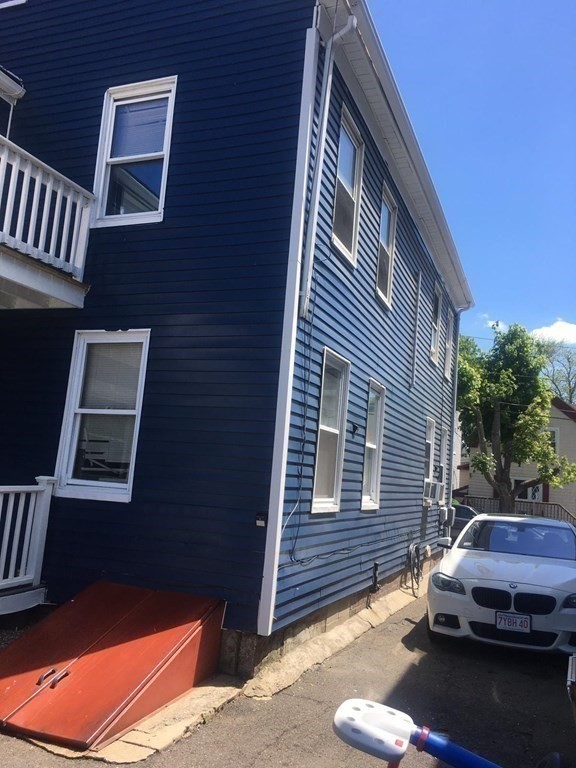 34 Grove Street Lynn, MA 01905 - Photo 30 of 37 a view of a house with a car park front of a house