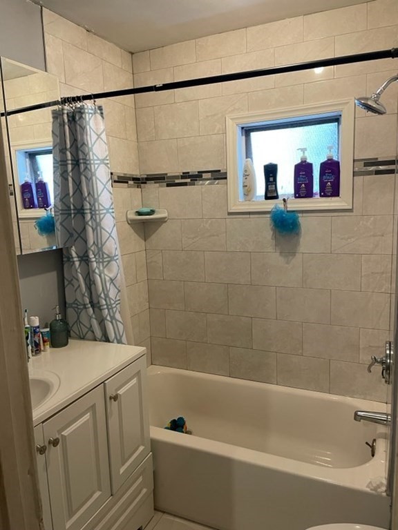 34 Grove Street Lynn, MA 01905 - Photo 4 of 37 a bathroom with a sink and a bathtub