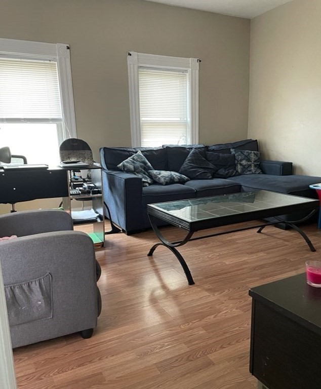 34 Grove Street Lynn, MA 01905 - Photo 8 of 37 a living room with furniture and a window