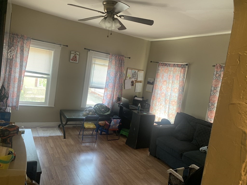 34 Grove Street Lynn, MA 01905 - Photo 10 of 37 a living room with furniture and a window