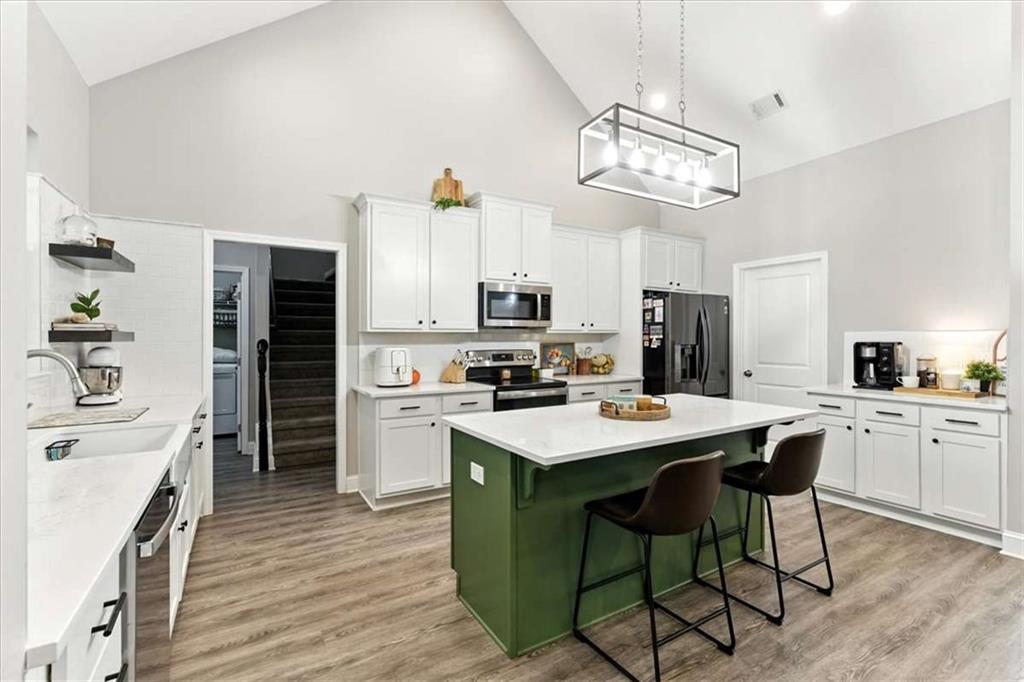 62 Joe Rowell Road Buchanan, GA 30113 - Photo 18 of 63 a kitchen with a table and chairs in it