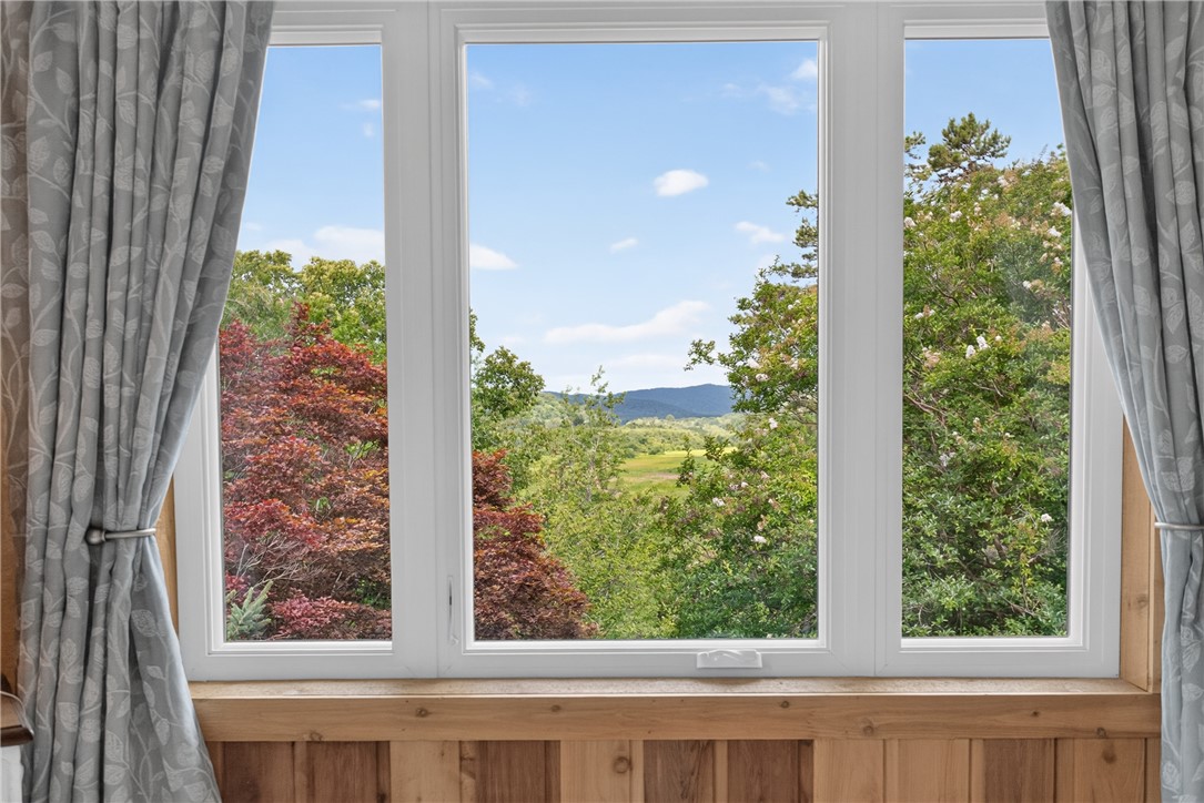 351 River Road Westminster, SC 29693 - Photo 21 of 50 Vast, open views of Blue Ridge Mountains and green landscapes from a picture window in the primary bedroom.