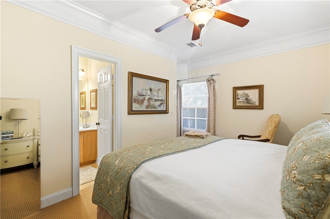 180 Palm Street St. Simons Island, GA 31522 - Photo 15 of 17 Primary with walk-in-closet and ensuite