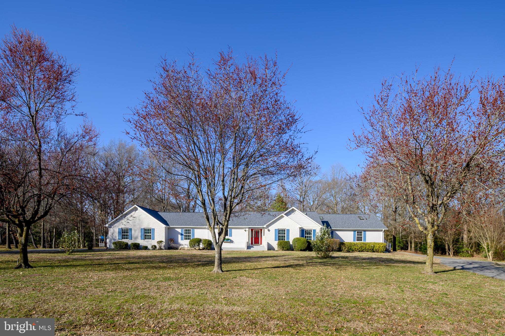 5885 Ketch Road Prince Frederick, MD 20678 - Photo 3 of 83 a front view of residential houses with yard and trees