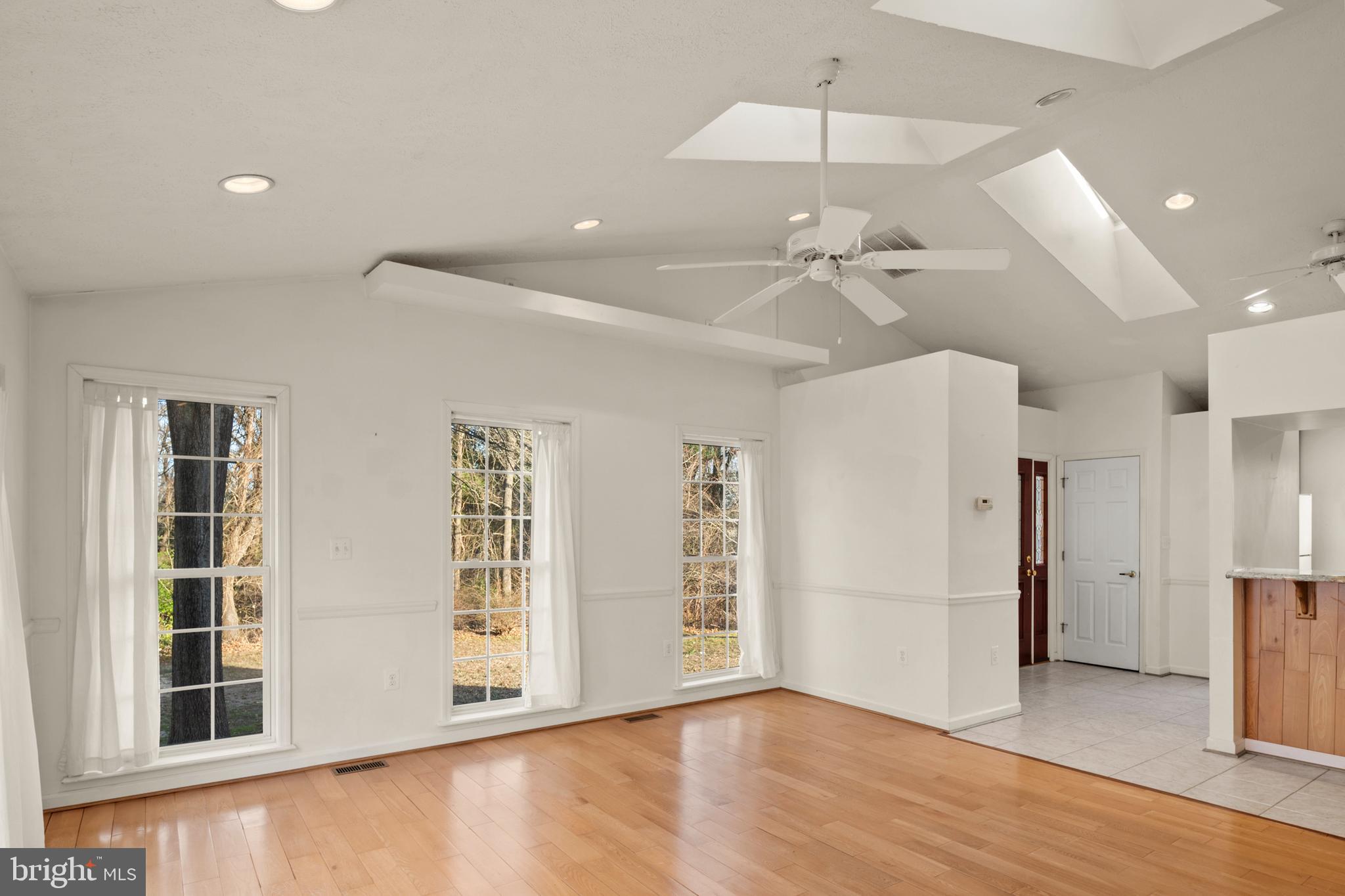 5885 Ketch Road Prince Frederick, MD 20678 - Photo 37 of 83 wooden floor in an empty room with a window