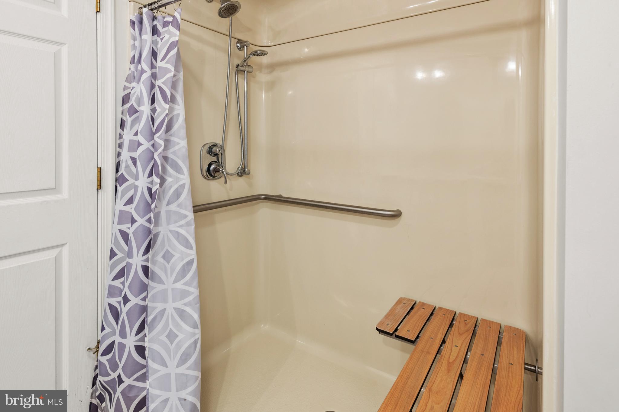 5885 Ketch Road Prince Frederick, MD 20678 - Photo 44 of 83 a bathroom with a shower and a shower curtain