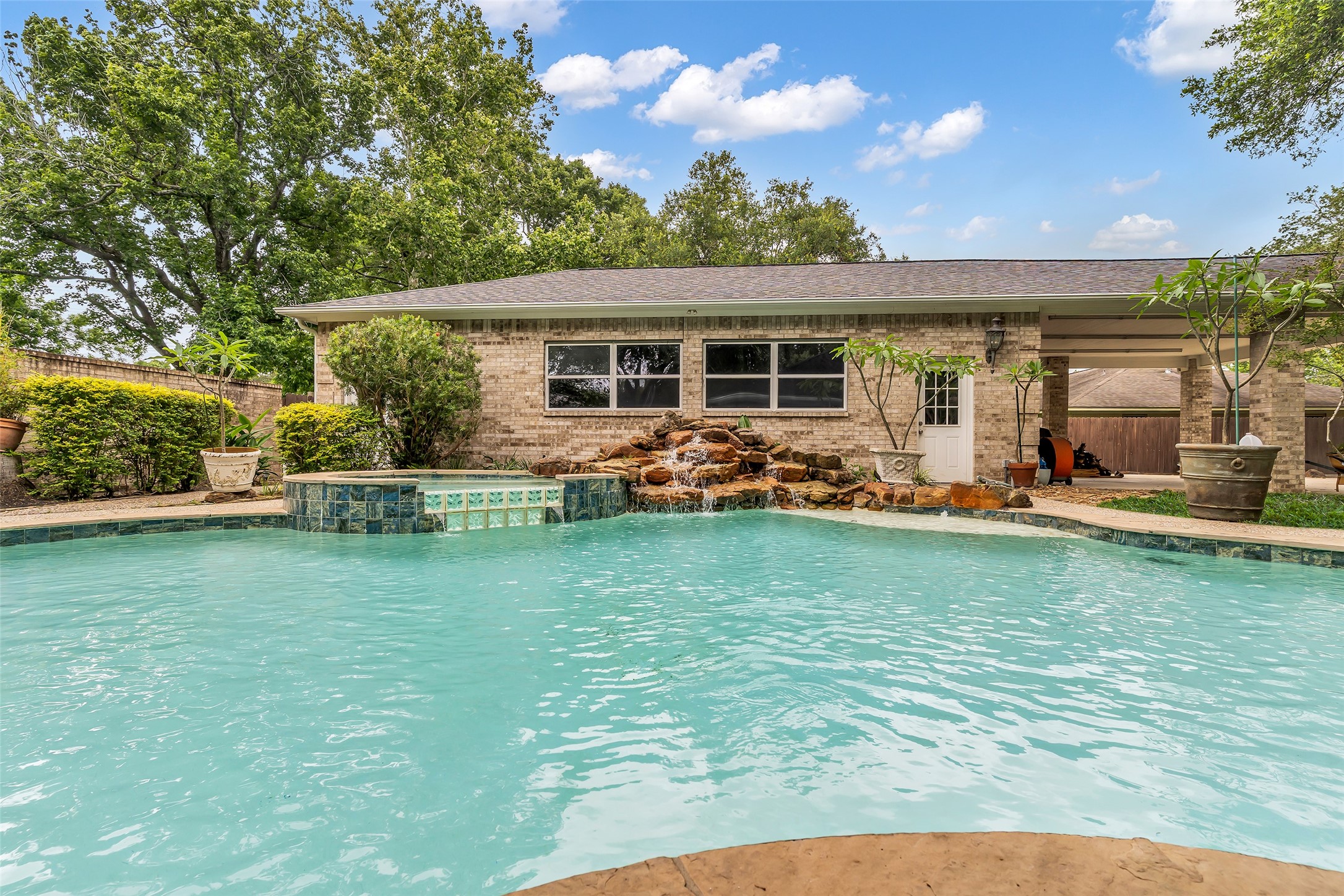 3519 Singleton Road Baytown, TX 77521 - Photo 33 of 42 resort style pool with waterfall