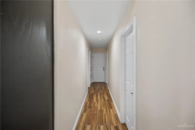 a view of a hallway with windows