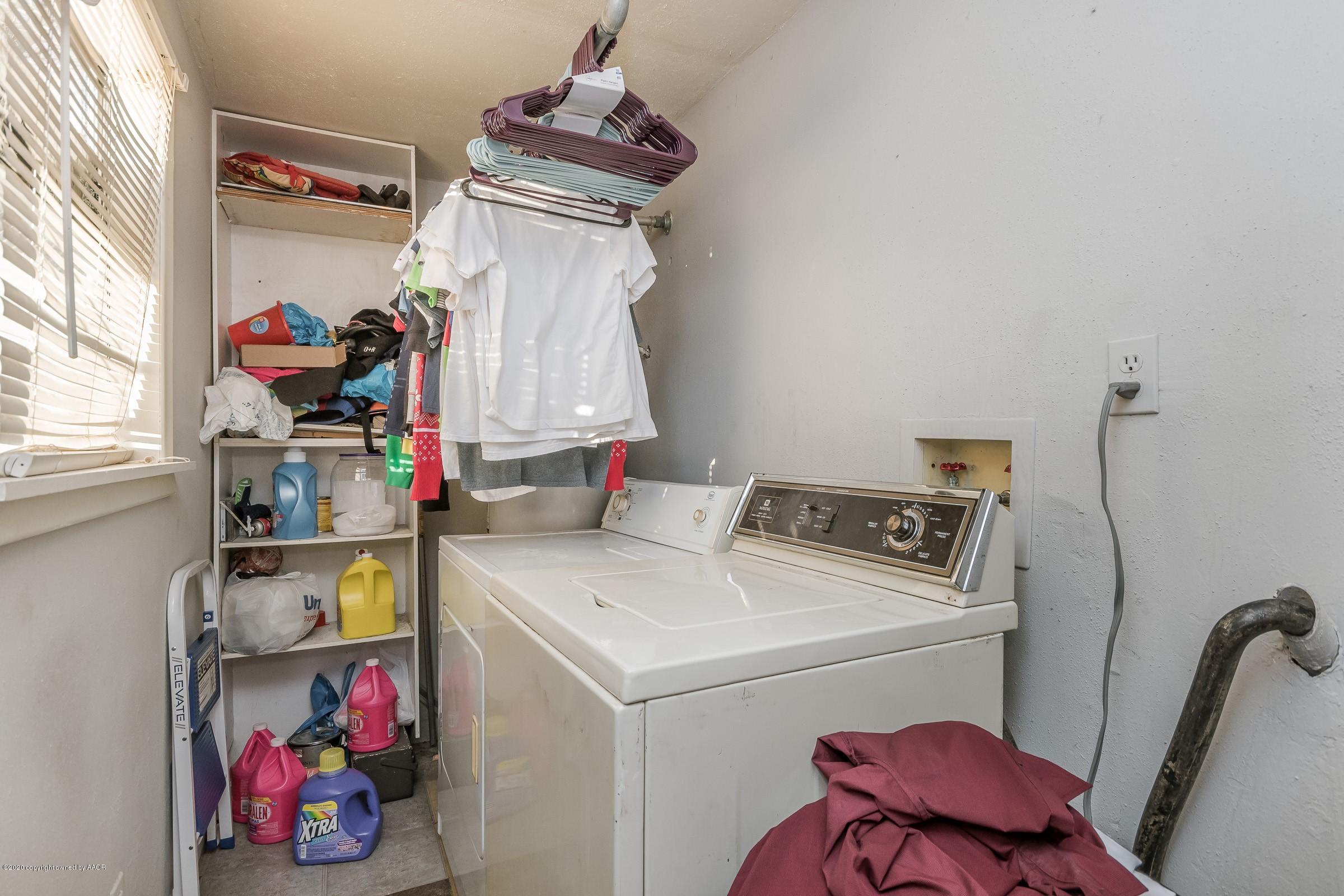 4602 South Travis Street Amarillo, TX 79110 - Photo 8 of 14 a utility room with dryer and washer