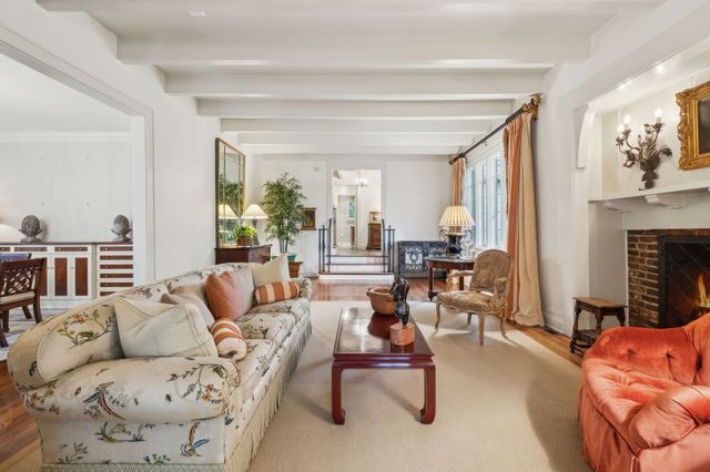 a kitchen with stainless steel appliances granite countertop a stove top oven a sink island and a refrigerator