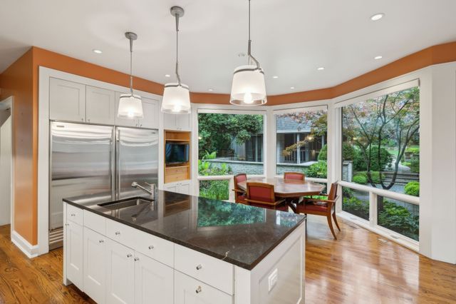 a bathroom with a double vanity sink and mirror
