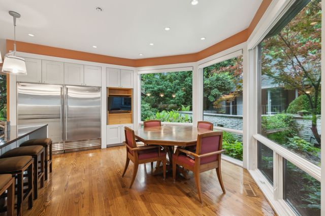 a bathroom with a granite countertop toilet
