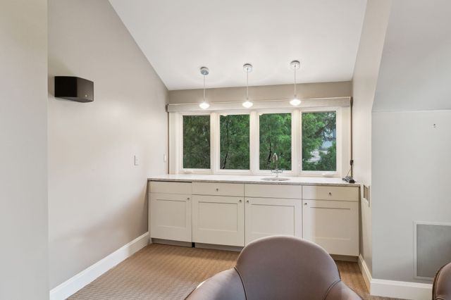 a view of a house with a yard and plants