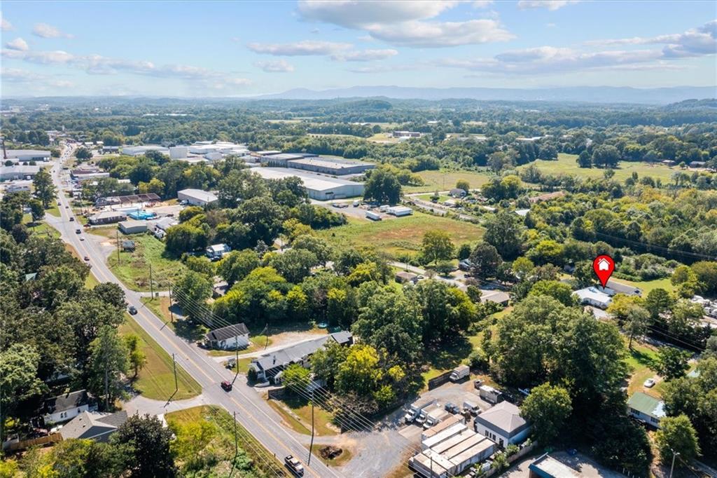 210 Hood Street Calhoun, GA 30701 - Photo 11 of 59 an aerial view of residential houses with outdoor space and trees
