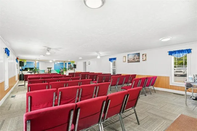 a living room with furniture and flowers