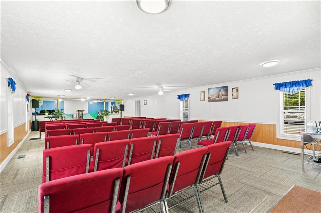 210 Hood Street Calhoun, GA 30701 - Photo 13 of 59 a projector room with furniture and a window