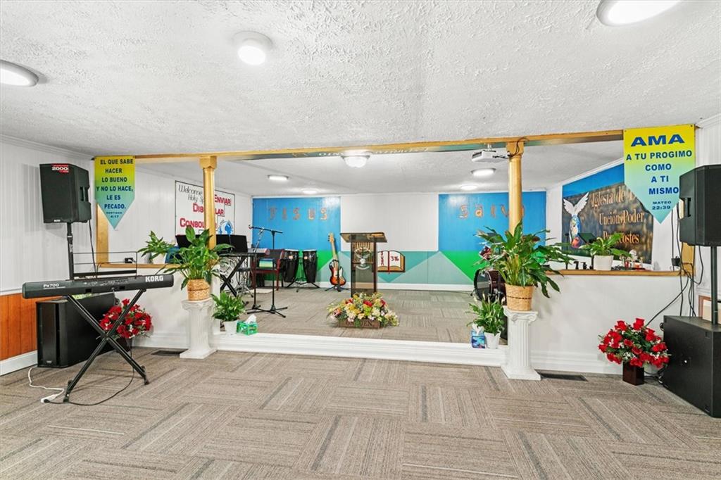 210 Hood Street Calhoun, GA 30701 - Photo 16 of 59 a living room with furniture and flowers