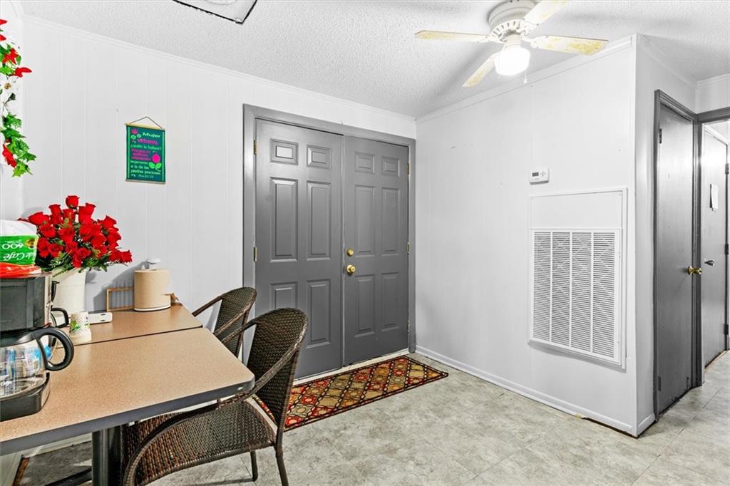 210 Hood Street Calhoun, GA 30701 - Photo 20 of 59 a view of a workspace with furniture and chandelier