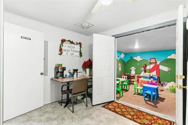 a view of a kitchen with a sink and cabinets
