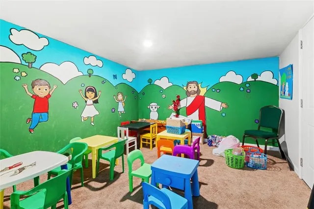 a kitchen with stainless steel appliances a refrigerator and a stove