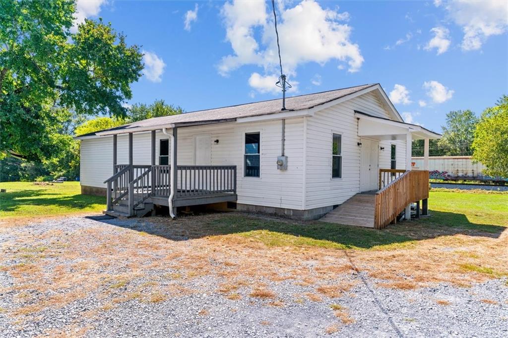 210 Hood Street Calhoun, GA 30701 - Photo 23 of 59 a view of a house with backyard and sitting area