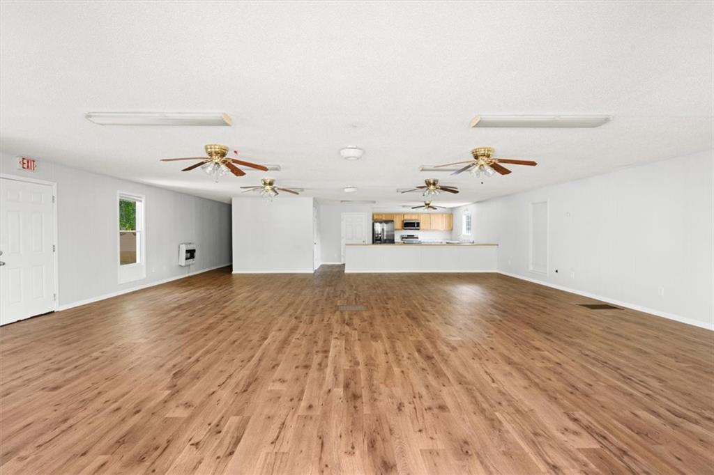 210 Hood Street Calhoun, GA 30701 - Photo 24 of 59 wooden floor in an empty room