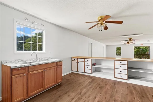 an aerial view of a houses with a yard