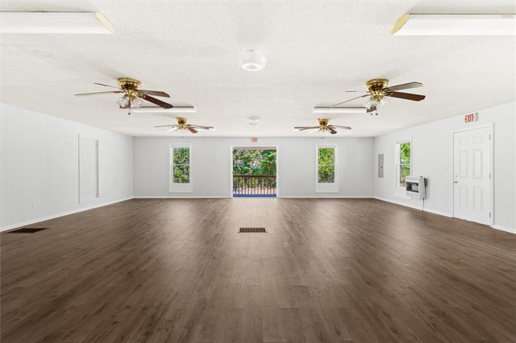 210 Hood Street Calhoun, GA 30701 - Photo 34 of 59 wooden floor in an empty room with a window