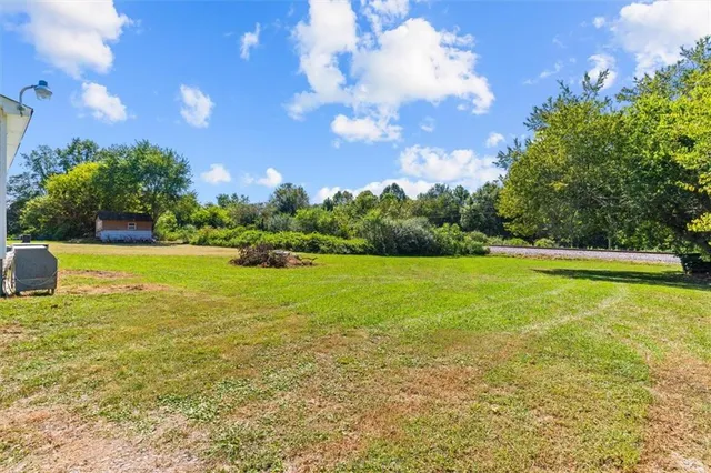 an aerial view of a house with a lake view