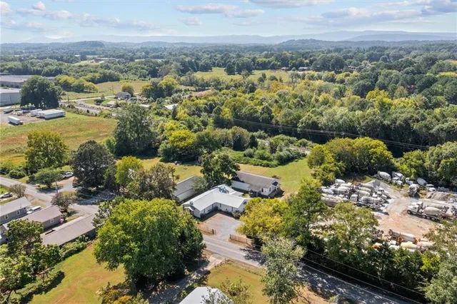 a view of a livingroom with workspace and a window