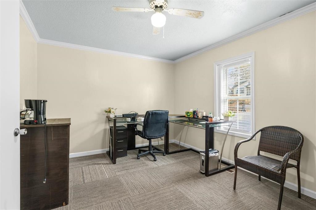 210 Hood Street Calhoun, GA 30701 - Photo 47 of 59 a view of a workspace with furniture and a window