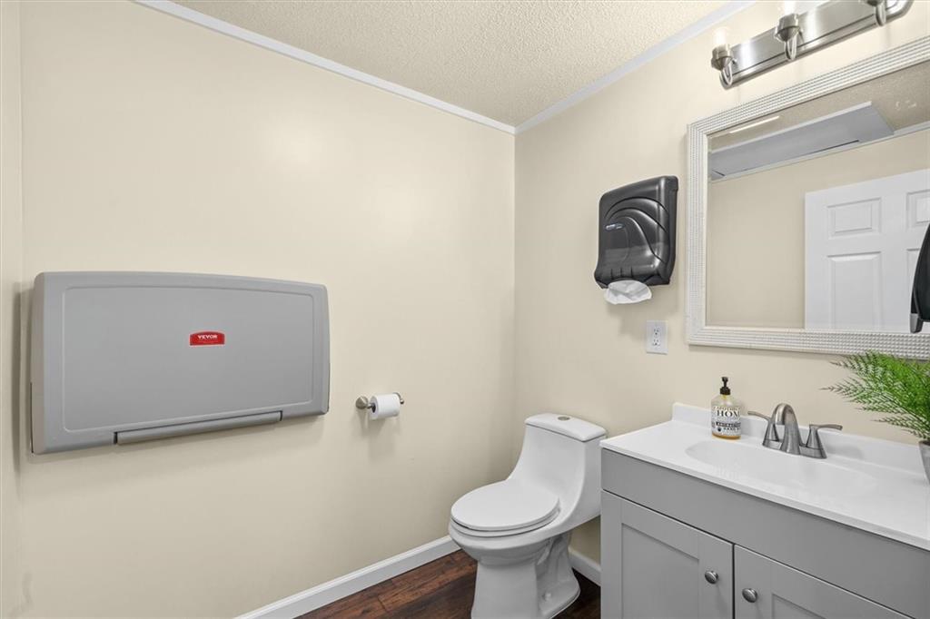 210 Hood Street Calhoun, GA 30701 - Photo 50 of 59 a bathroom with a sink and a toilet