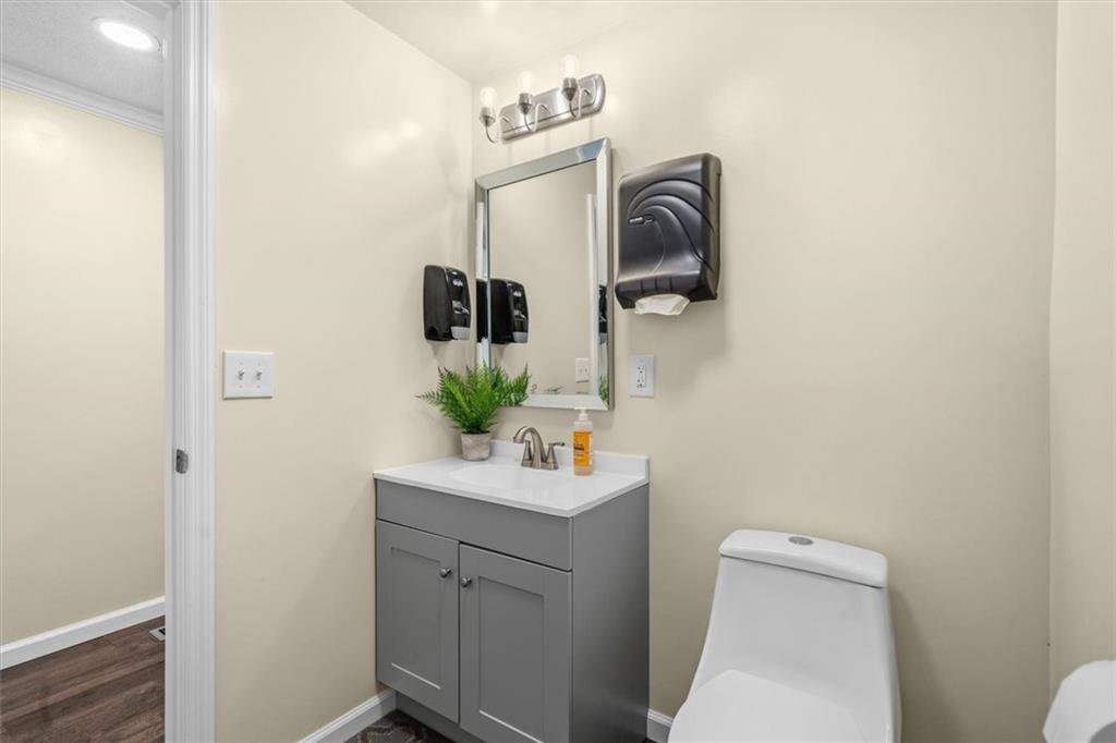 210 Hood Street Calhoun, GA 30701 - Photo 53 of 59 a bathroom with a sink vanity and toilet