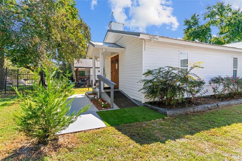 210 Hood Street Calhoun, GA 30701 - Photo 6 of 59 a front view of a house with garden