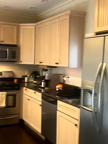 a kitchen with a sink and a microwave