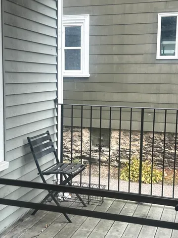 a view of a porch with a bench