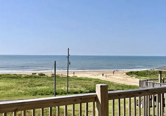 a view of a chairs and table in the balcony