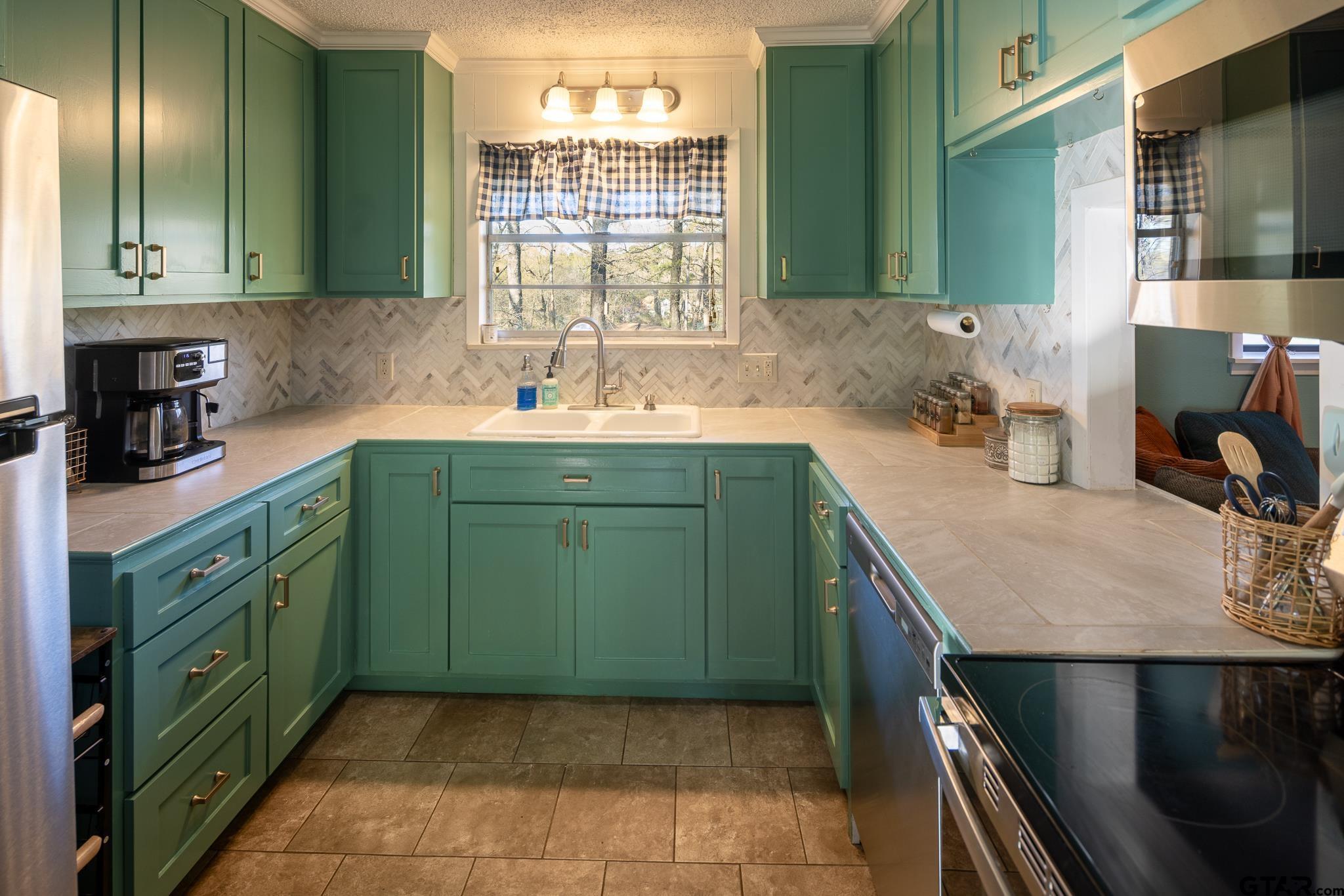 10733 County Road 4150 Tyler, TX 75704 - Photo 12 of 48 a kitchen with a sink and cabinets