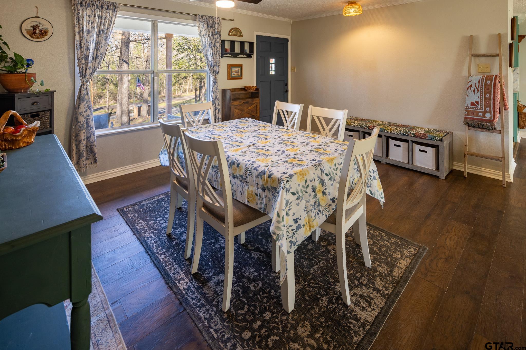 10733 County Road 4150 Tyler, TX 75704 - Photo 17 of 48 a dining room with furniture and wooden floor
