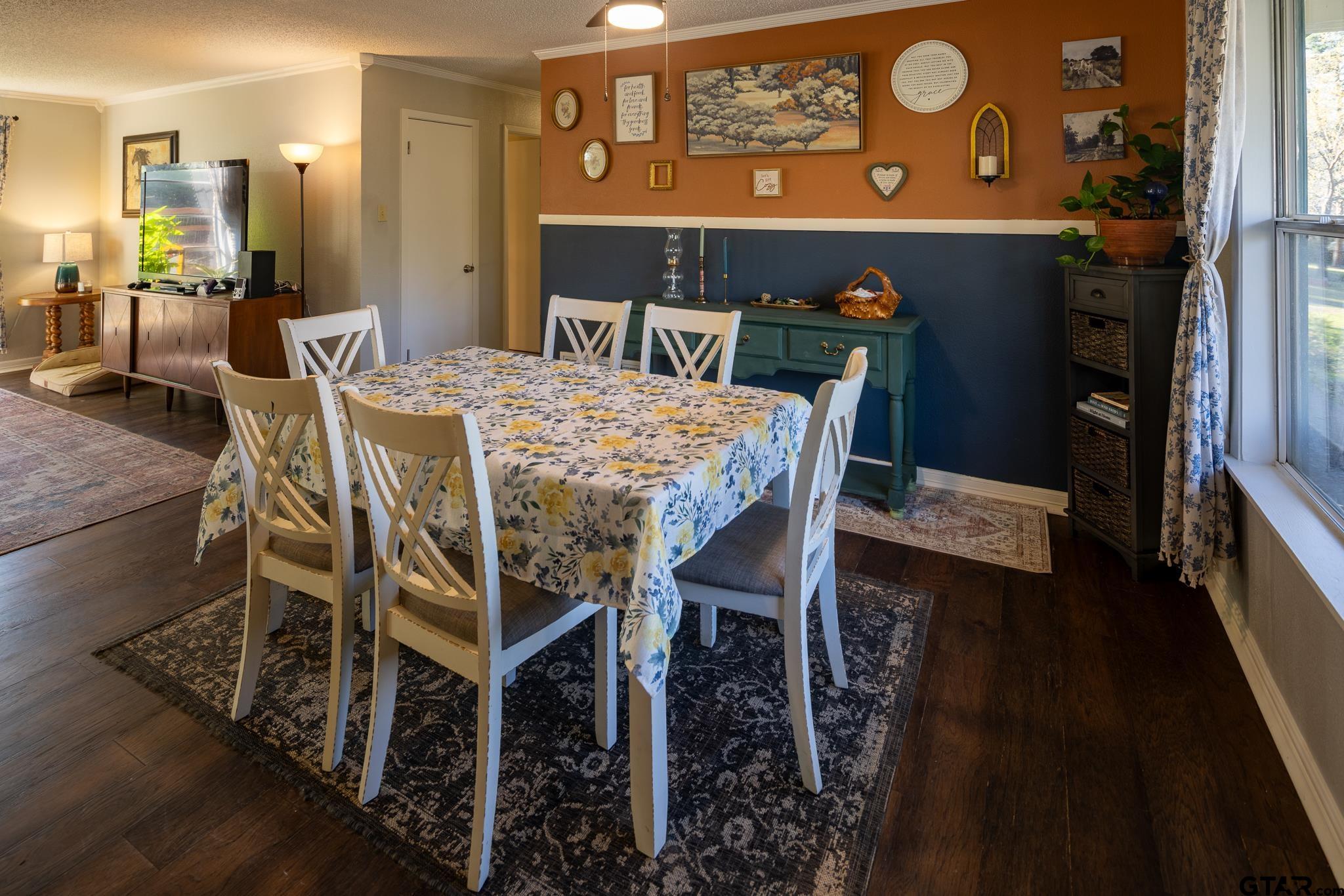 10733 County Road 4150 Tyler, TX 75704 - Photo 18 of 48 a view of a dining room with furniture and wooden floor