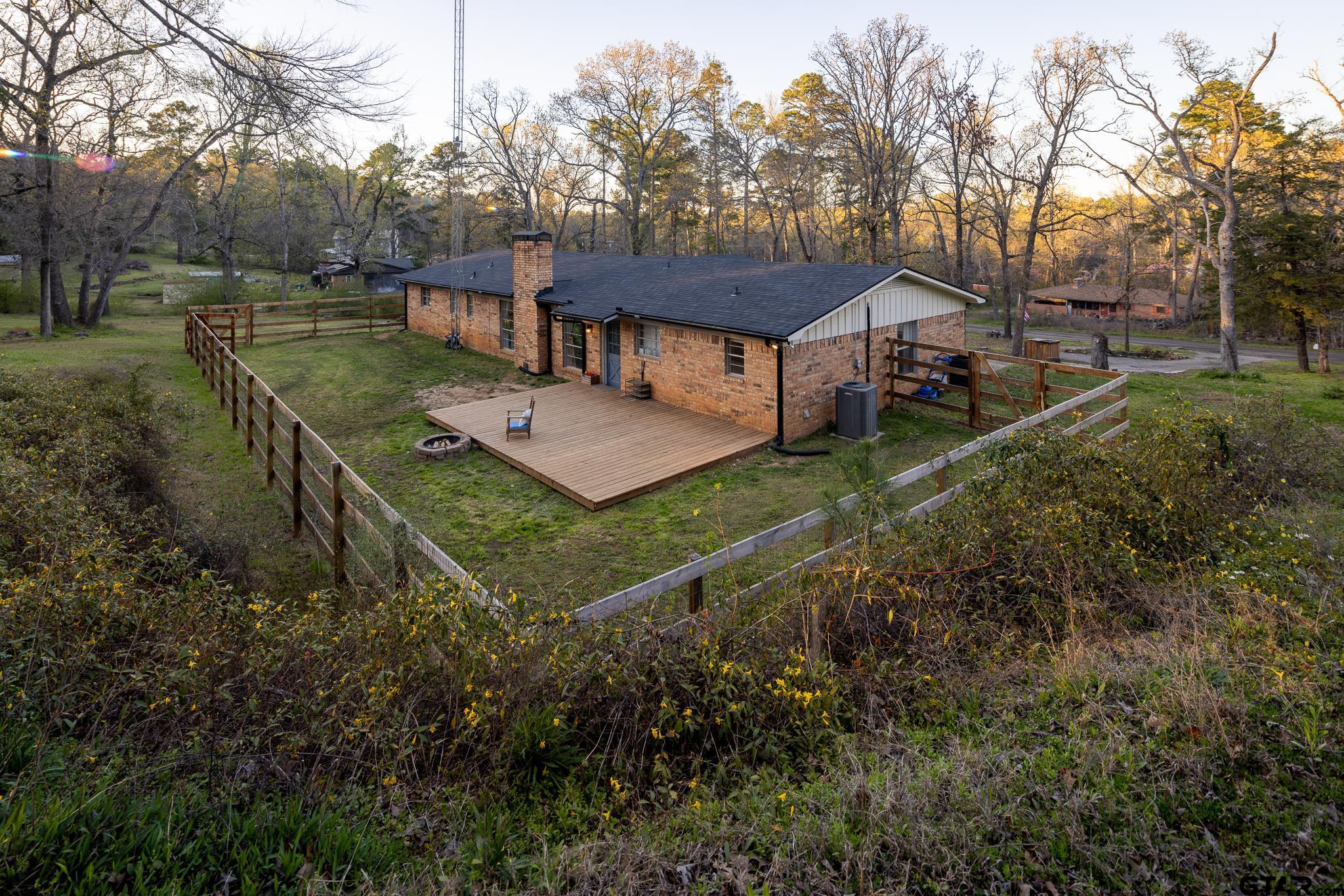 10733 County Road 4150 Tyler, TX 75704 - Photo 2 of 48 a view of a house with a big yard plants and large trees