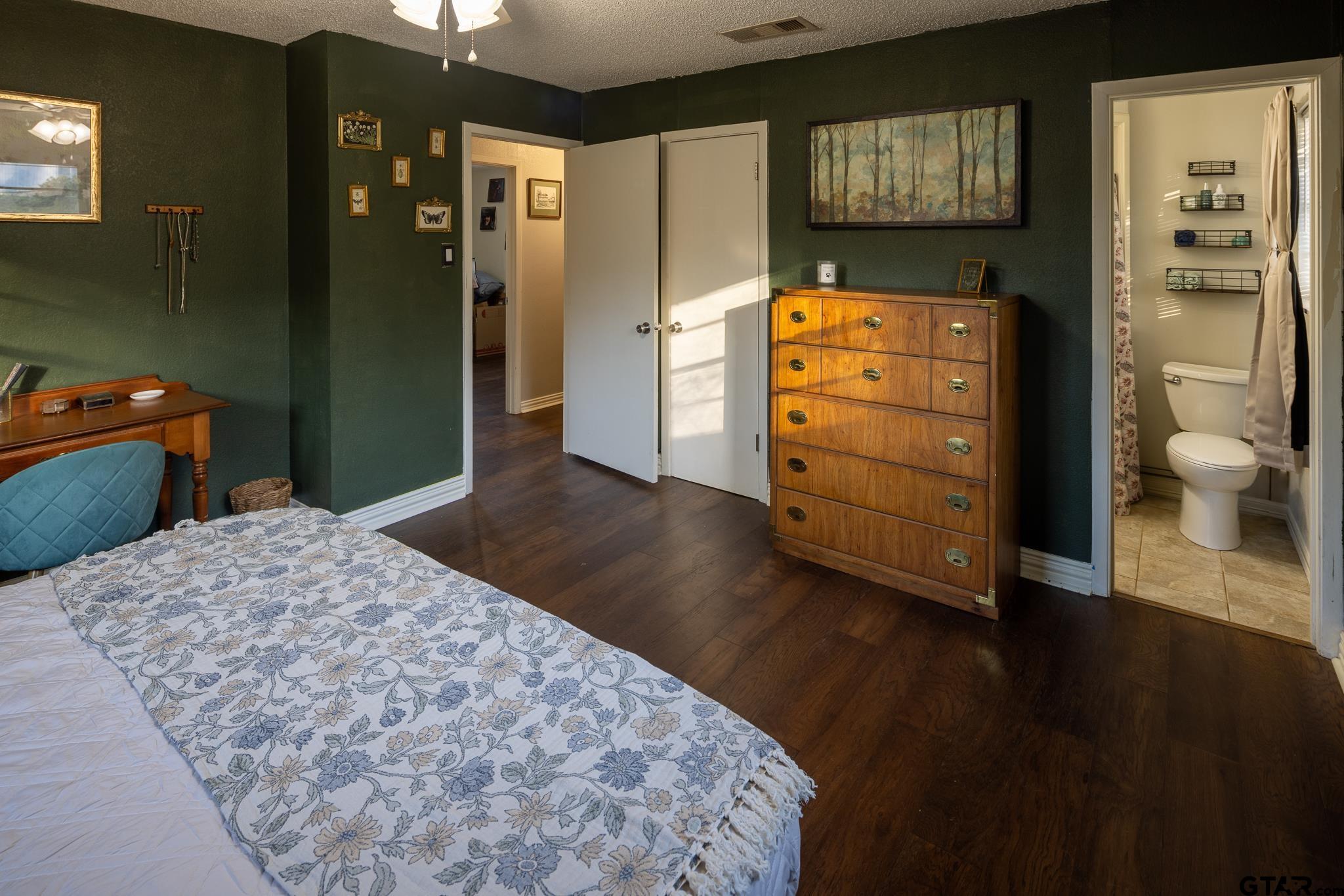 10733 County Road 4150 Tyler, TX 75704 - Photo 25 of 48 a bedroom with a bed and wooden floor